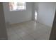 Bright bedroom featuring tile floors and a window at 2007 Cutlass Dr # 0, Henderson, NV 89014