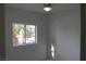 Simple bedroom with tile floors and a window with natural light at 2007 Cutlass Dr # 0, Henderson, NV 89014