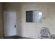 Private condo entrance with white door and small patio with chair at 2007 Cutlass Dr # 0, Henderson, NV 89014