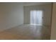 Living room featuring tile floors and sliding glass door to balcony at 2007 Cutlass Dr # 0, Henderson, NV 89014