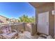 Balcony with wicker chairs and view of the complex at 2101 Quartz Cliff St # 207, Las Vegas, NV 89117