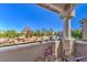 Relaxing balcony with seating area and view of landscaping at 2101 Quartz Cliff St # 207, Las Vegas, NV 89117