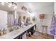 Bathroom with double vanity, dark cabinets, and decorative towels at 2101 Quartz Cliff St # 207, Las Vegas, NV 89117