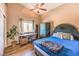 Spacious bedroom with large bed, desk, and plenty of natural light at 2101 Quartz Cliff St # 207, Las Vegas, NV 89117