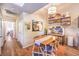 Bright dining area with wood table and four chairs, adjacent to kitchen at 2101 Quartz Cliff St # 207, Las Vegas, NV 89117