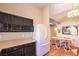 Kitchen with dark cabinets, stainless steel appliances and a white refrigerator at 2101 Quartz Cliff St # 207, Las Vegas, NV 89117