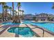 Community pool and spa with surrounding lounge chairs at 2101 Quartz Cliff St # 207, Las Vegas, NV 89117