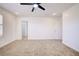 Spacious bedroom with ceiling fan, carpet, and window shutters at 2120 Waterlily View St, Henderson, NV 89044