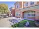 Townhouse exterior with front door and walkway at 2120 Waterlily View St, Henderson, NV 89044