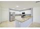 Kitchen boasts stainless steel appliances and granite countertops at 2120 Waterlily View St, Henderson, NV 89044