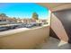 Private balcony overlooking a parking area and surrounding buildings at 2451 N Rainbow Blvd # 2144, Las Vegas, NV 89108