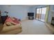 Living room with a comfortable sofa and a view to the balcony at 2451 N Rainbow Blvd # 2144, Las Vegas, NV 89108