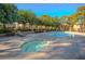 Community pool and spa with lounge chairs and landscaping at 2451 N Rainbow Blvd # 2144, Las Vegas, NV 89108