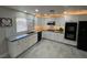 Modern kitchen with granite countertops, stainless steel appliances, and white cabinets at 2620 Silverton Dr, Las Vegas, NV 89134