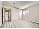 This bedroom features neutral walls, wood-look floors, and a window for lots of natural light at 2668 Alwoodley Cir, Las Vegas, NV 89142