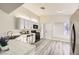 Well-lit kitchen boasts ample counter space, stainless steel appliances, and modern finishes at 2668 Alwoodley Cir, Las Vegas, NV 89142