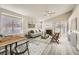 Bright living room featuring neutral paint, light wood flooring, fireplace and bright natural light at 2668 Alwoodley Cir, Las Vegas, NV 89142