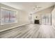 Bright living room featuring neutral paint, light wood flooring, fireplace and bright natural light at 2668 Alwoodley Cir, Las Vegas, NV 89142