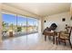 Living room with hardwood floors, golf course view, and balcony access at 3111 Bel Air Dr # 4G, Las Vegas, NV 89109