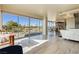 Open concept living area with city views and modern kitchen at 3111 Bel Air Dr # 4G, Las Vegas, NV 89109