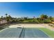 Tennis court with green landscaping and city views at 3111 Bel Air Dr # 4G, Las Vegas, NV 89109