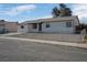 Single story house with a gravel yard at 3883 Seedling Way, Las Vegas, NV 89115