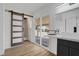 Spa-like bathroom with a barn door, modern vanity, and sliding glass door at 3883 Seedling Way, Las Vegas, NV 89115