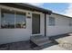 House exterior with a green door and gray siding at 3883 Seedling Way, Las Vegas, NV 89115