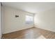 Bedroom featuring wood-look flooring and a window at 4775 Summerhill Rd, Las Vegas, NV 89121