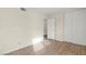 Bedroom with wood-look floors and mirrored closet at 4775 Summerhill Rd, Las Vegas, NV 89121