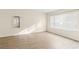 Spacious bedroom with large window and wood-look floors at 4775 Summerhill Rd, Las Vegas, NV 89121