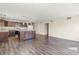 Open concept kitchen with island and hardwood flooring at 4775 Summerhill Rd, Las Vegas, NV 89121