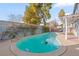 Relaxing kidney-shaped pool in sunny backyard at 4775 Summerhill Rd, Las Vegas, NV 89121