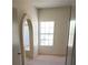 Spacious bedroom with large window and adjacent bathroom access at 4801 Fiesta Lakes St, Las Vegas, NV 89130