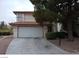 Two-story home with attached garage and landscaping at 4801 Fiesta Lakes St, Las Vegas, NV 89130