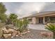 Landscaped backyard with patio and rock garden at 5124 Pensier St, Las Vegas, NV 89135