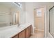 Clean bathroom with single sink vanity and shower/tub combo at 5124 Pensier St, Las Vegas, NV 89135