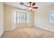 Bright bedroom with bay window and ceiling fan at 5124 Pensier St, Las Vegas, NV 89135