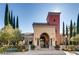 Elegant building exterior with arched entryway and landscaping at 5124 Pensier St, Las Vegas, NV 89135