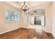 Elegant dining room with hardwood floors and a chandelier at 5124 Pensier St, Las Vegas, NV 89135