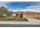 One-story house with desert landscaping and two-car garage at 5124 Pensier St, Las Vegas, NV 89135