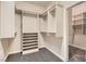 Spacious walk-in closet with built-in shelves and hanging rods at 5124 Pensier St, Las Vegas, NV 89135