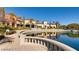 Community pond with walkway and manicured landscaping at 5124 Pensier St, Las Vegas, NV 89135