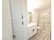 Clean bathroom with white vanity, shower/tub combo, and linen closet at 5222 Mandalay Springs Dr # 202, Las Vegas, NV 89120