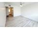 Spacious bedroom with ceiling fan and light gray vinyl flooring at 5222 Mandalay Springs Dr # 202, Las Vegas, NV 89120