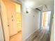 Clean hallway with light walls and wood-look floors at 5222 Mandalay Springs Dr # 202, Las Vegas, NV 89120