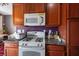 White stove and microwave in this kitchen at 6040 Emma Bay Ct # 101, North Las Vegas, NV 89031