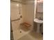 Accessible bathroom with shower, seat, grab bars, and pedestal sink at 609 W Victory Rd, Henderson, NV 89015