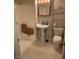 Bathroom with pedestal sink, shower, and toilet at 609 W Victory Rd, Henderson, NV 89015