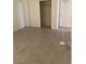 Spacious bedroom with tile flooring and mirrored closet doors at 609 W Victory Rd, Henderson, NV 89015